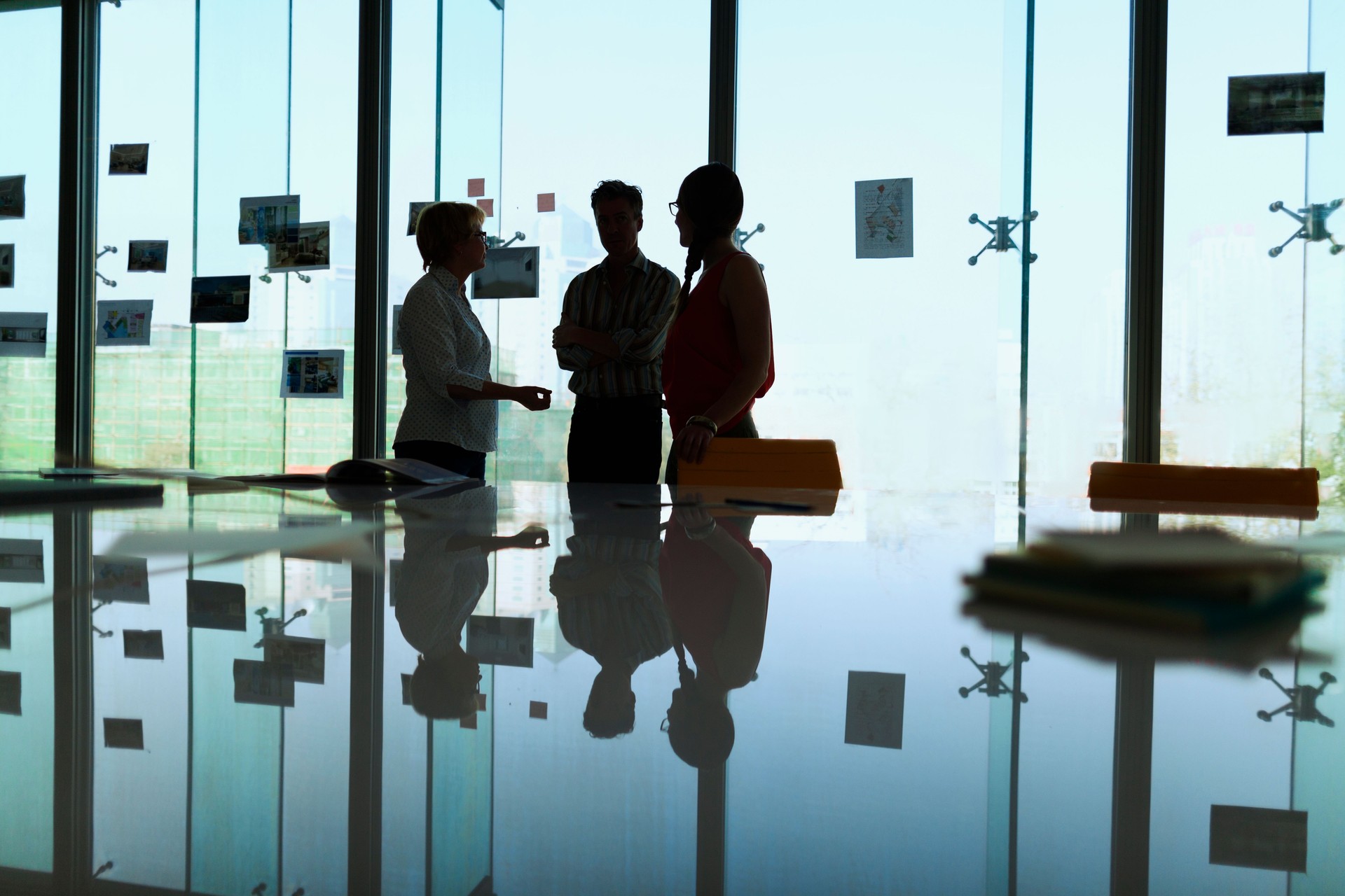 Silhouette of colleagues meeting in office conference room